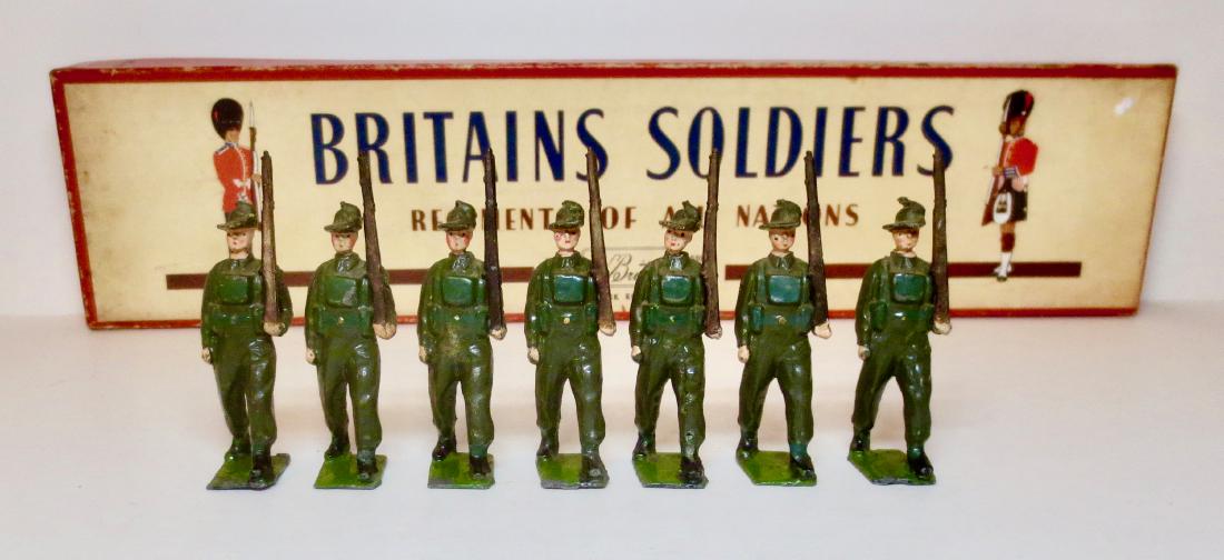 Britains #2031 Australian Army Infantry: Battle Dress. 7 pieces (one figure missing). Excellent condition. Post war in ROAN box. Box good with a tear on one side of top.