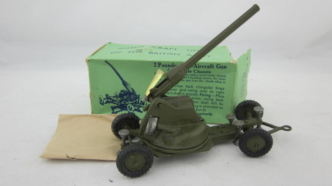 Britains Set #1717 Mobile Anti-Aircraft Gun.: AA Gun on mobile chassis in khaki with sealed bag of shells. 1 piece. Condition excellent+ in tattered box, 2 end flaps off but present.