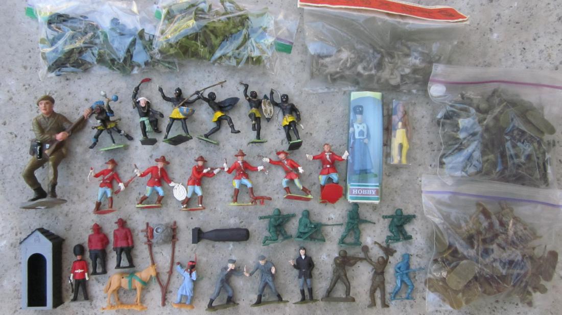 World-Wide Plastics Menagerie.: Timpo Sentry with sentry box, Indian Squaw with horse & sled to pull, Cherilea Zulus, Marx Canadian Mounties, American Plastics Canadian Commandos, Highlanders & Boy Scouts, Header bag of Russia-made