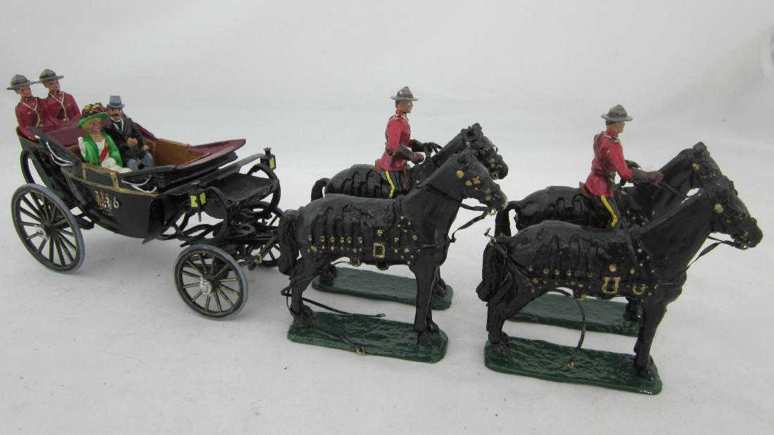 Toy Soldier House Open State Landau.: Canadian Black Open State Landau with Royal Canadian Mountie Escort, commerating Queen Elizabeth II first visit to Ottawa, Canada in 1957. 7 pieces. Condition very good. No box. Horses are solid cast 