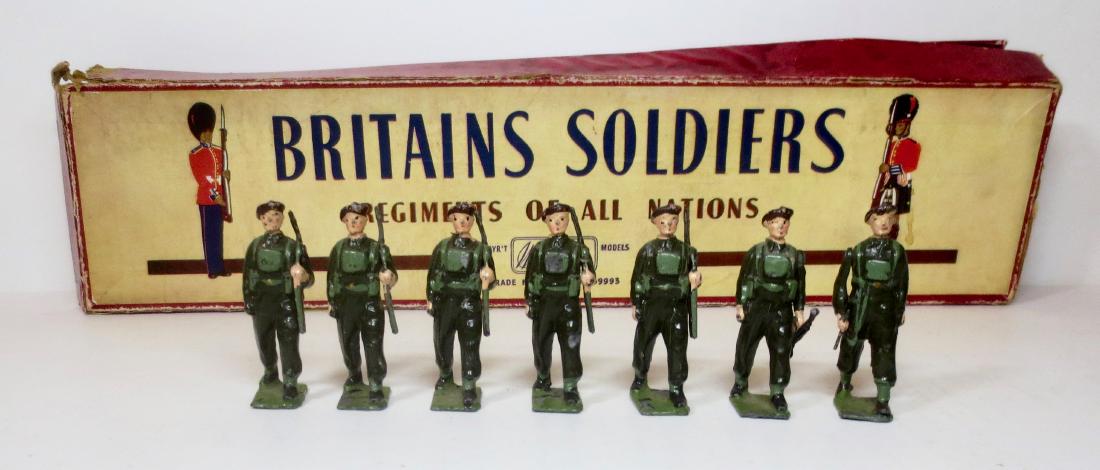 Britains From #2011 Royal Air Force Regiment: Britains Royal Air Force Regiment. Includes; Officer, 5 Infantry with slung rifles, and 1 Bren Gun carrier. Post war issue. 7 pieces. Very good condition (with some paint loss). Comes with a plain, un