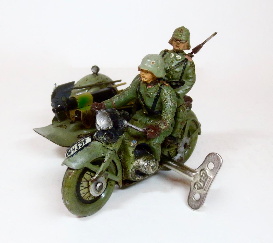 Lineol Motorcycle with Side Car and Machine Gun: Lineol Rare Composition & Tin Motorcycle with Driver and removeable passenger. Circa mid 1930's. 3 pieces. Excellent condition. Unboxed.