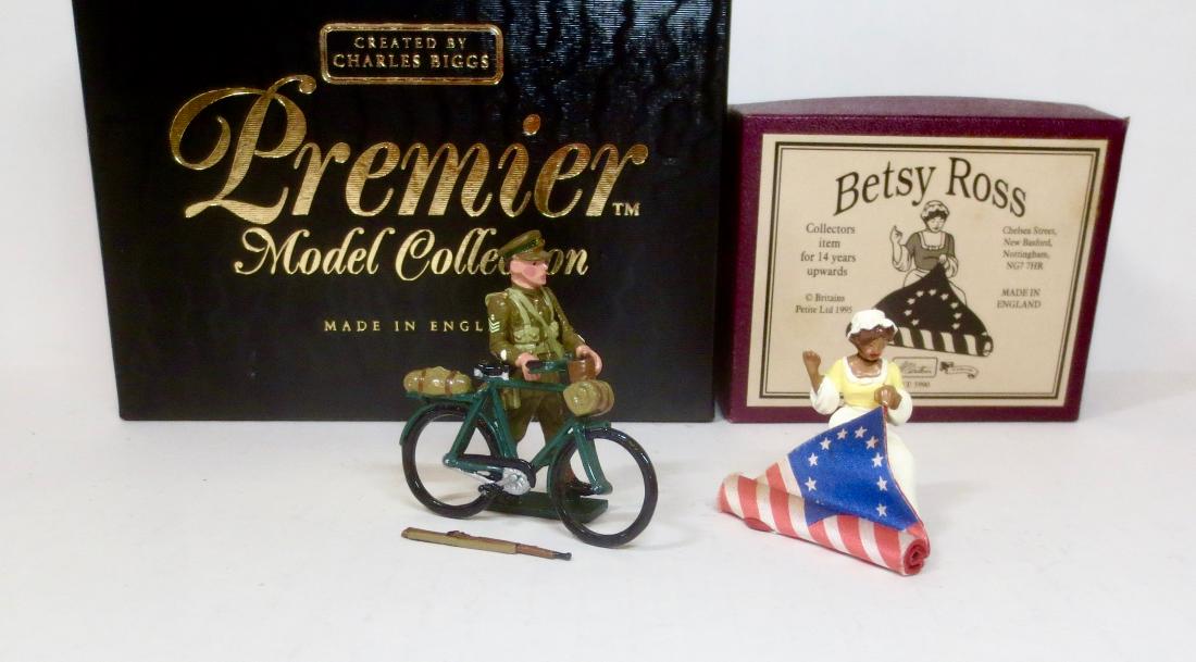 Premier #9801 & Britains #5990: Premier WW1 Cyclist in good condition (loose rifle), and Britains Betsy Ross in Excellent condition. Boxes excellent.