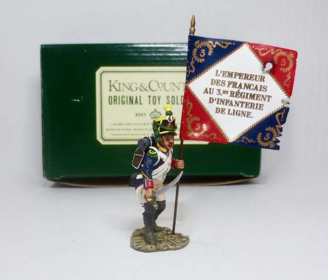 King & Country French Sergeant with Flag: French Sergeant with Flag and drawn Sword. Retired figure from the Age of Napoleon Series. 2 pieces (including flag). Excellent condition. Comes with a plain green K & C box. Box very good.