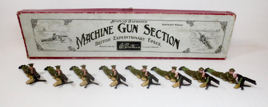 Britains #194 Machine Gun Section: Pre war with Illustrated Whisstock box. 8 pieces. Six peaked cap gunners and two in shrapnel helmets. Excellent condition. Box very good (one tear and side split on box).