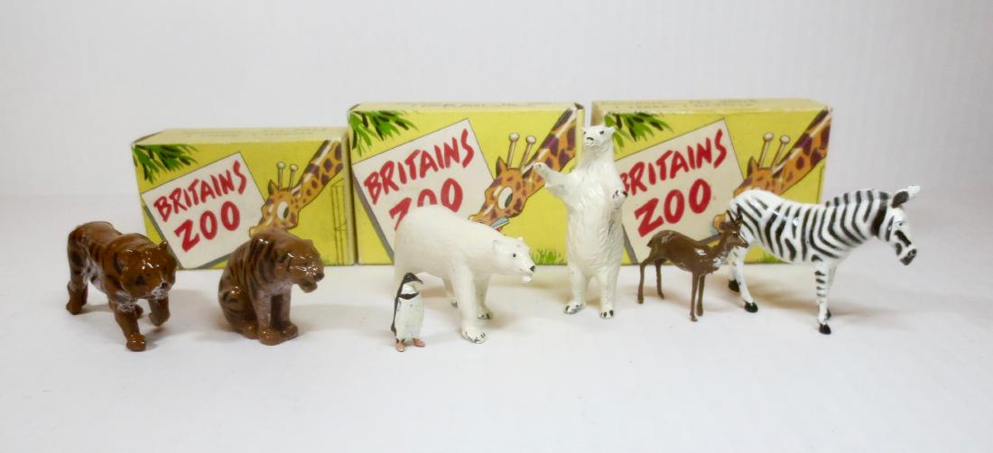 Britains Zoo Picture Packs: Post war with Illustrated boxes. Includes; Tiger & Tigress (#9015), Polar Bears & Penguin (#9007), Zebra and Gazelle (#9008). 7 pieces. Excellent condition. Boxes very good (2 missing inner flaps).
