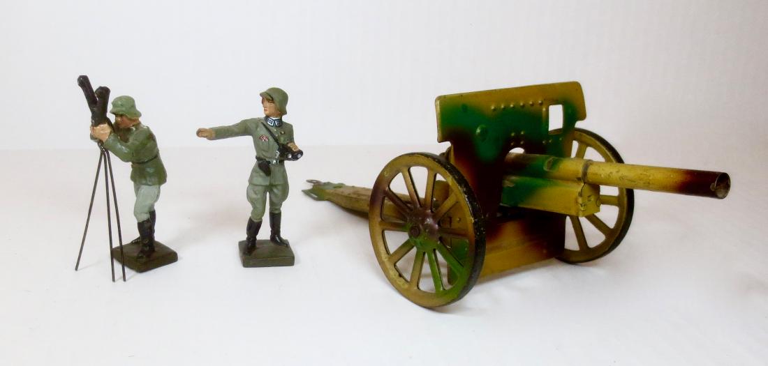 Lineol Tin Field Artillery Gun and Germans: 3 pieces. Includes Tin Field Artillery Gun, and composition German officer. Plus Rare German soldier with Range Finder. 7 cm scale. Excellent condition.
