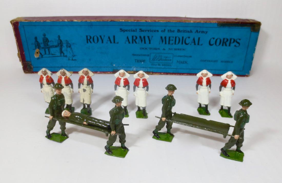 Britains From #1723 Royal Army Medical Corps: Post war. 13 pieces. Excellent to very good condition (3 nurses mismatched with some paint loss). Comes with a Pre war #320 Illustrated box in poor condition.