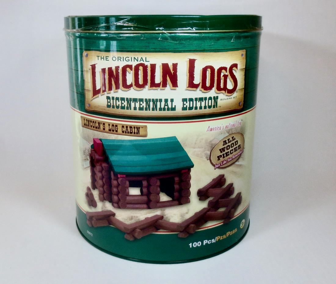 Lincoln Logs Bicentennial Edition Tin: Lincoln's Log Cabin. Designed to honor the 200th anniversary of President Abraham Lincoln's birth. 100 pieces. Mint in sealed tin (never opened). Tin in mint condition.