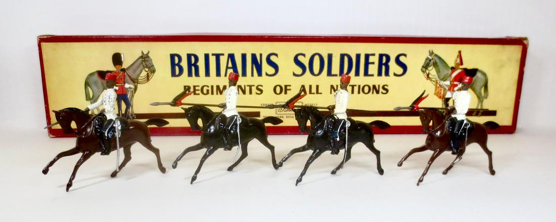 Britains #115 Egyptian Cavalry: Egyptian Cavalry with lancers. Post war in ROAN box. 4 pieces including officer. Excellent condition Box very good (one top corner split).