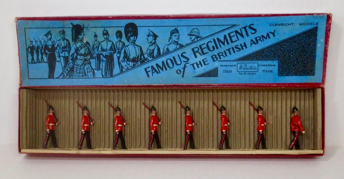Britains #1570 Ox & Bucks Light Infantry: Oxford and Buckinghamshire Light Infantry, Marching Slope Arms. 1937 version. Red tunics with white facings and green helmets. 8 pieces. Excellent condition. Blue "Famous Regiments" lid label box. Box
