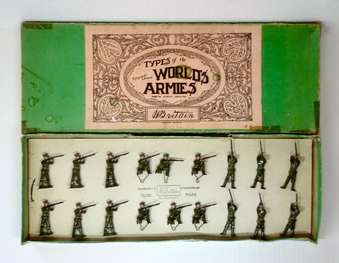 Britains #1328 British Infantry Display Set: British Infantry Standing, Kneeling and Lying (Firing) in Khaki uniforms with Peak Hats. Pre war. 18 pieces. Excellent condition. Retied in Types of the World Armies (Green) box. Box fair (stains, spl