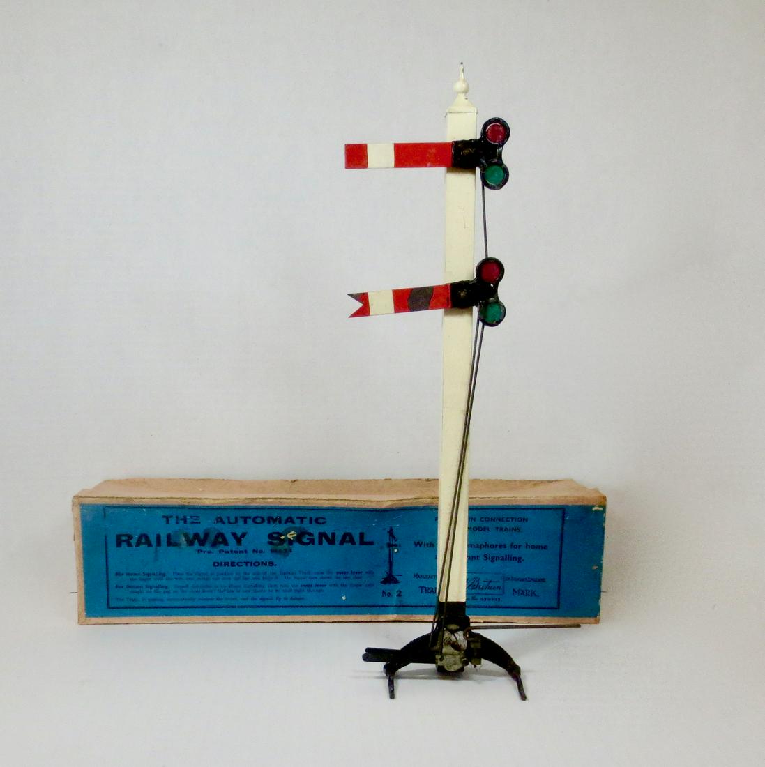 Britains VERY RARE #2 Railway Signal: VERY RARE Automatic Railway Signal with two Semaphores for home and distant signaling. Comes with original Illustrated box. 4 pieces. Excellent condition. Exceedingly rare box is in good condition (on