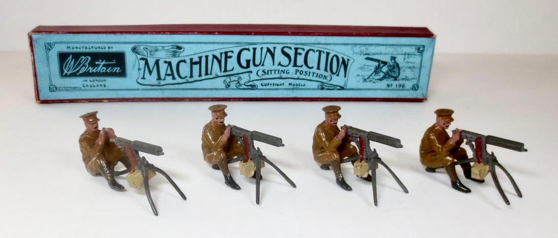 Britains #198 Machine Gun Section: Machine Gun Section, seated position in Peak Caps firing Vickers machine guns. 1930 version. 4 pieces. Excellent condition. Box good (top splits on all corners).
