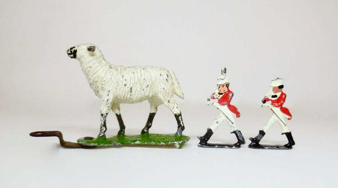 Britains Advertising Figures: Sarson's Vinegar Lamb circa 1932, and two Johnny Walker miniature Talisman figures, circa 1935. 3 pieces. Very good condition.