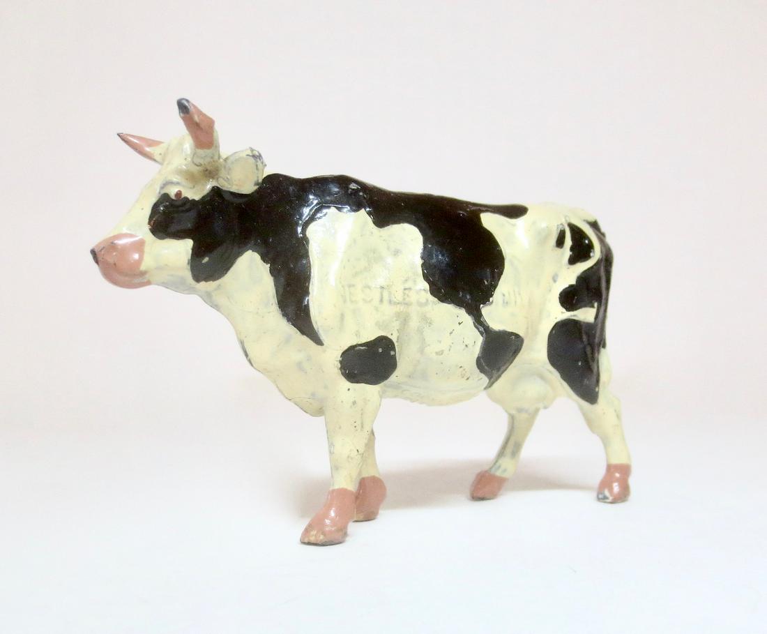Britains RARE Nestle's World Cow: Rare promotional item with map of the world embossed on one side of the cow, and on the other side Nestlé's milk. Circa 1924. Excellent condition. Unboxed.