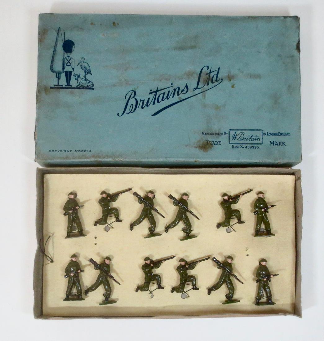 Britains #7A Infantry in Battle Dress: Infantry In Battle Dress, with Tommy Guns and Rifles. Circa 1948. 12 pieces, restrung in original box. Excellent condition. Box good (with surface wear on top).