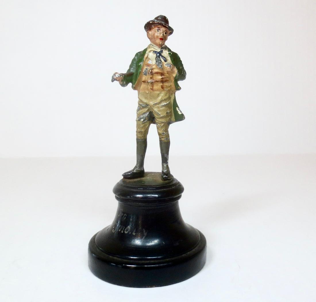 Heyde Irish figure on wooden base: Dapper Irish figure in green coat and hat, on wooden base. Measures 4-3/4" tall including base. Excellent condition.
