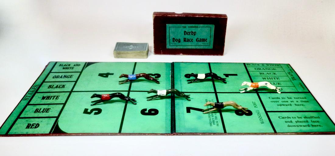 Johillco Cardora Derby Dog Race Game: Rare Cardora Derby Dog Race Game, including; six Johillco racing dogs, game board, and pack of playing cards. Pre war. Excellent to very good condition. Box very good.