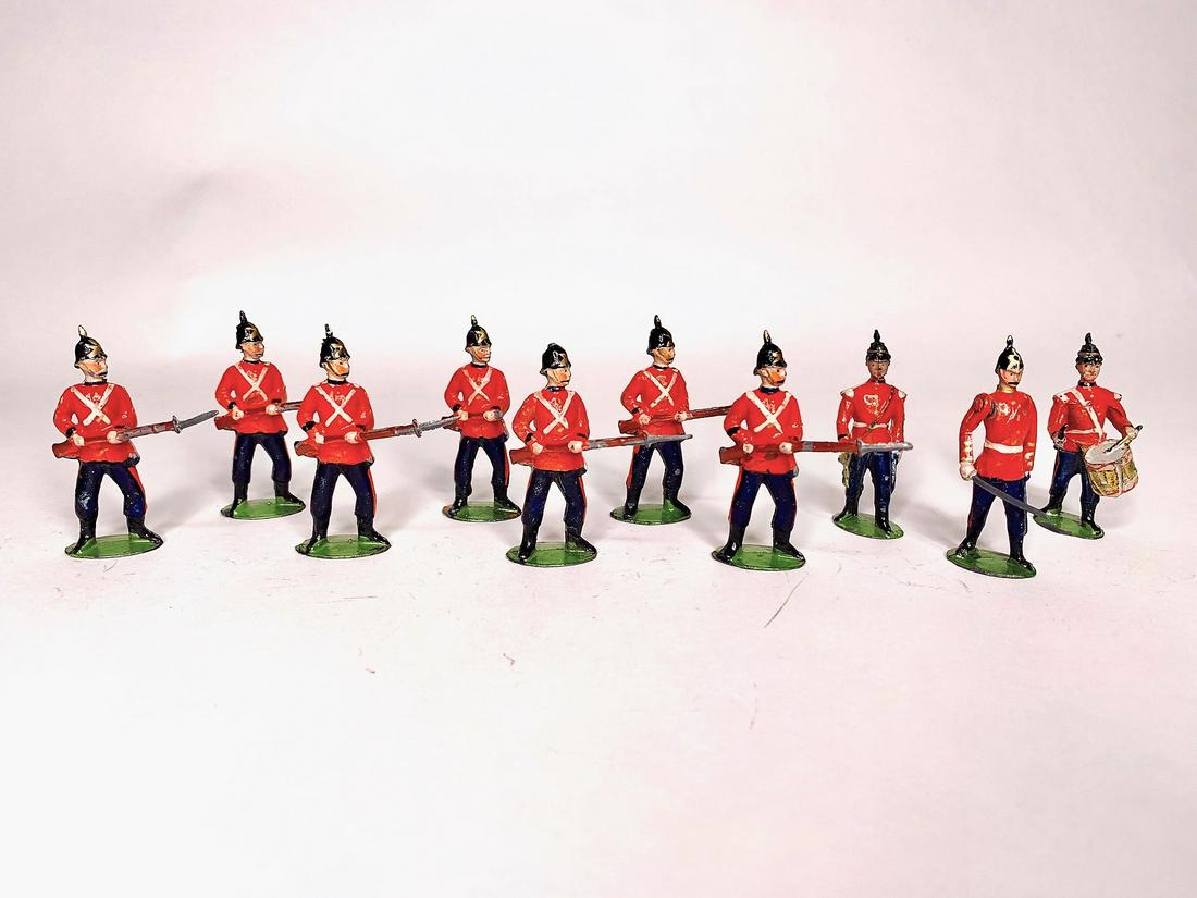 Britains Set #17 East Kent Regiment: 2nd Version on oval bases with musicians and Officer. Circa 1895. 10 Pieces. Condition Very Good, missing one rifle end, two bayonet tips and one helmet spike, no box.