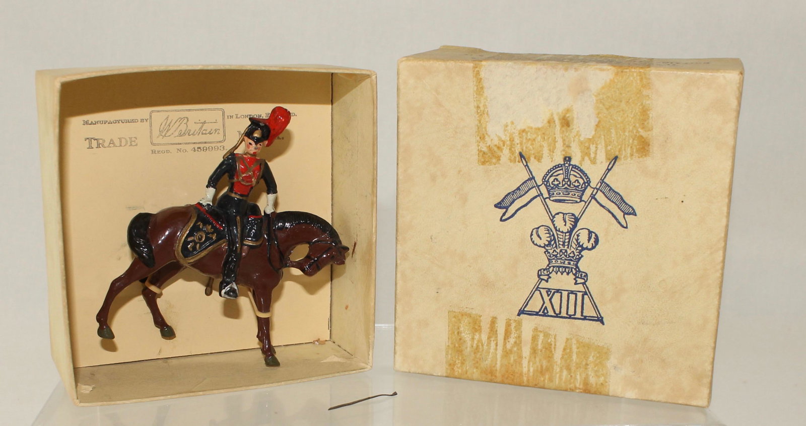 Britains Set #2169 12th Royal Lancer Officer: Mounted Officer of the 12th Royal Lancers. Made only 1958-59. 1 Piece. Condition Very Good. Sword Broken but Present. Box Fair with Tape Residue.