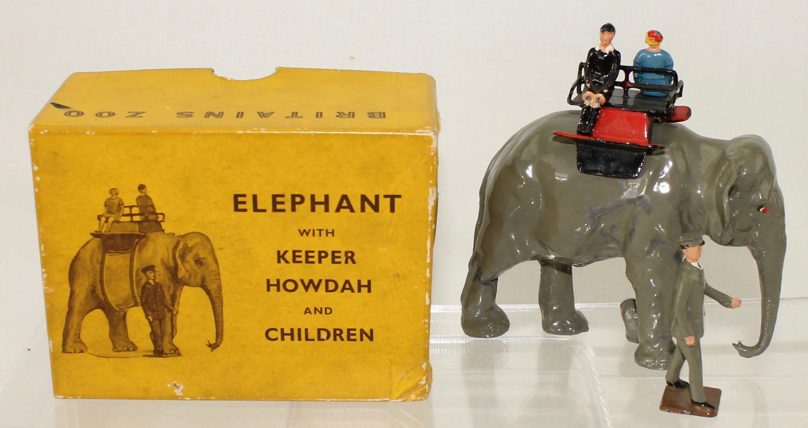 Britains Set #25-Z Elephant Ride with Keeper: Elephant Ride with Keeper, Howdah and Children. Made 1954-60. 5 Pieces. Condition Good to Excellent. Paint Wear to Elephant's Side. Box Good.