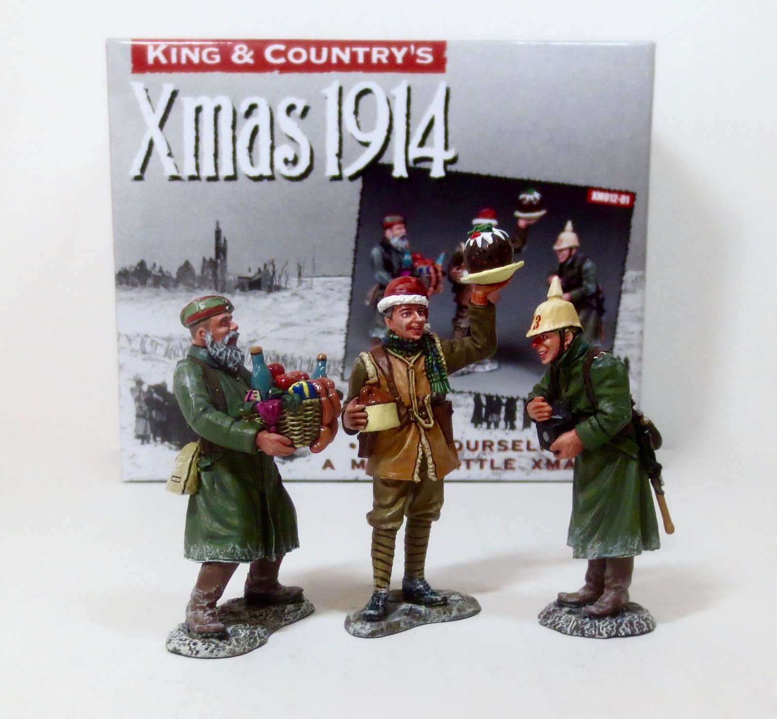 King & Country #XM012-01 Christmas 1914: Depicts a scene from the incredible Christmas of 1914 when the Brits and Germans put a halt to the fighting and celebrated the spirit of Christmas together. Retired set. 3 pieces. Near mint condition.