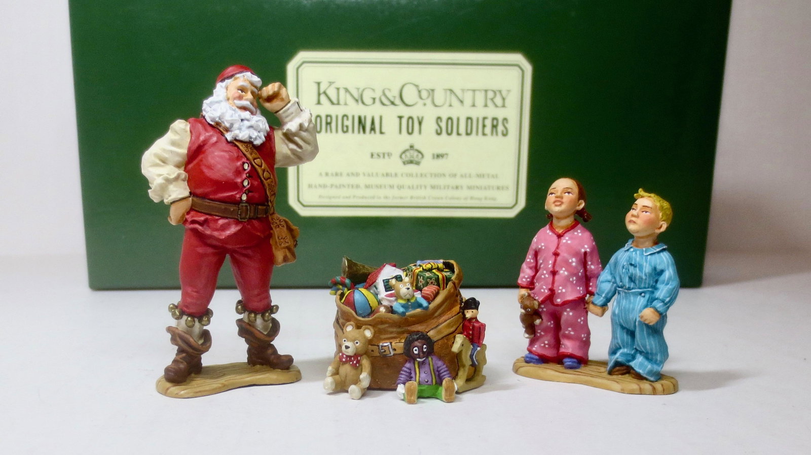 King & Country XM003-01 Christmas Santa Set: Santa thinks about what to do when two children find him with the goodies on Christmas Eve. Retired set. 3 pieces. Near mint condition. Box excellent.