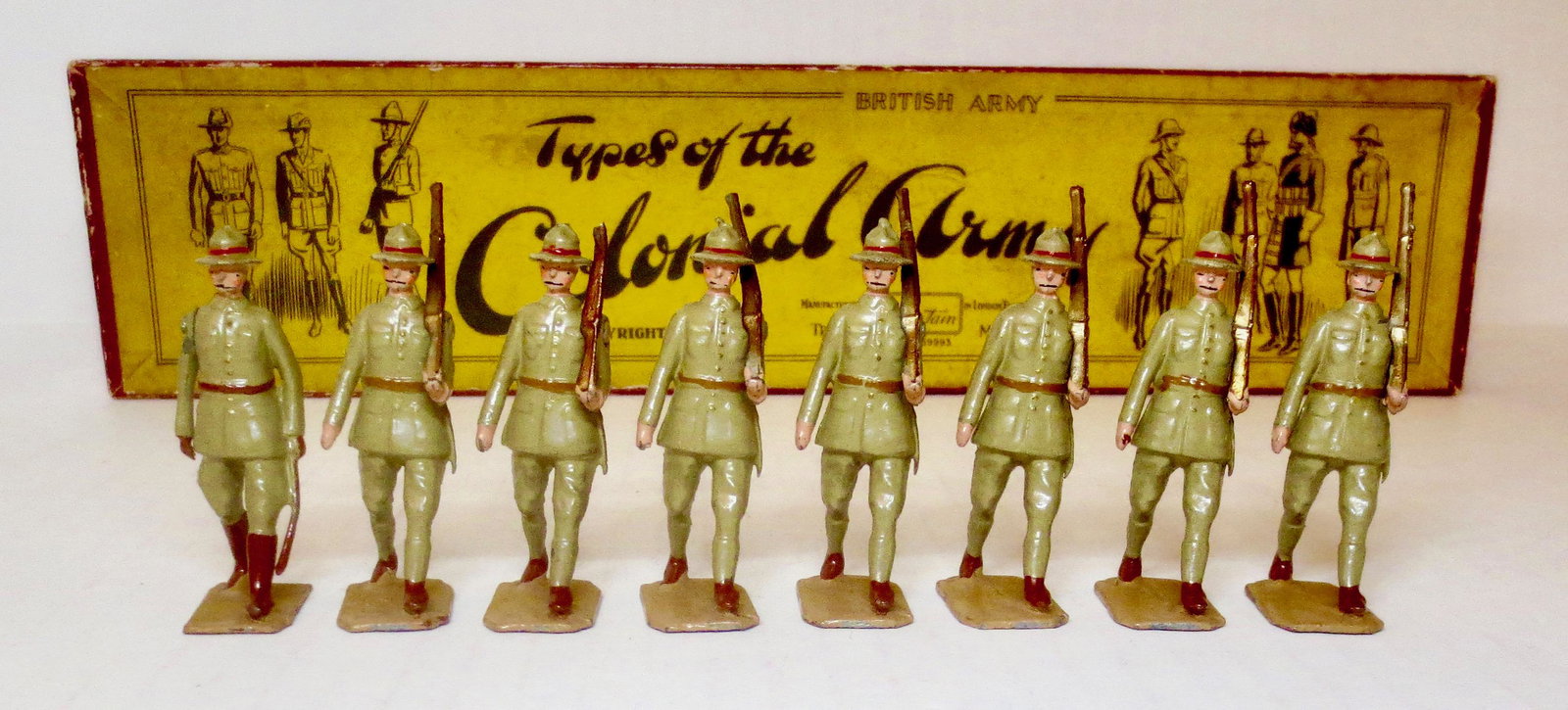 Britains #1542 New Zealand Infantry: New Zealand Infantry marching at the slope. 1938 version, with original illustrated Types of The Colonial Army box. 8 pieces. Excellent to very good condition (one missing rifle tip). Box excellent, w