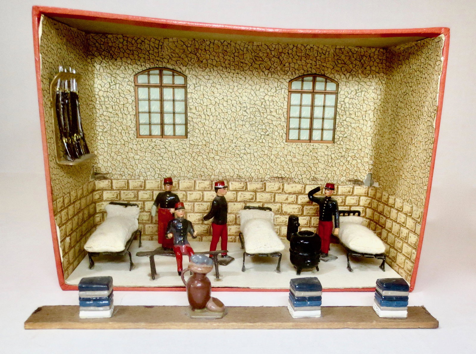 Mignot French Barracks Diorama: French Infantry of the Line Barracks diorama. 10 pieces. Good to fair condition (shelf, pictured in front and several other pieces have come loose). Box fair, missing top.