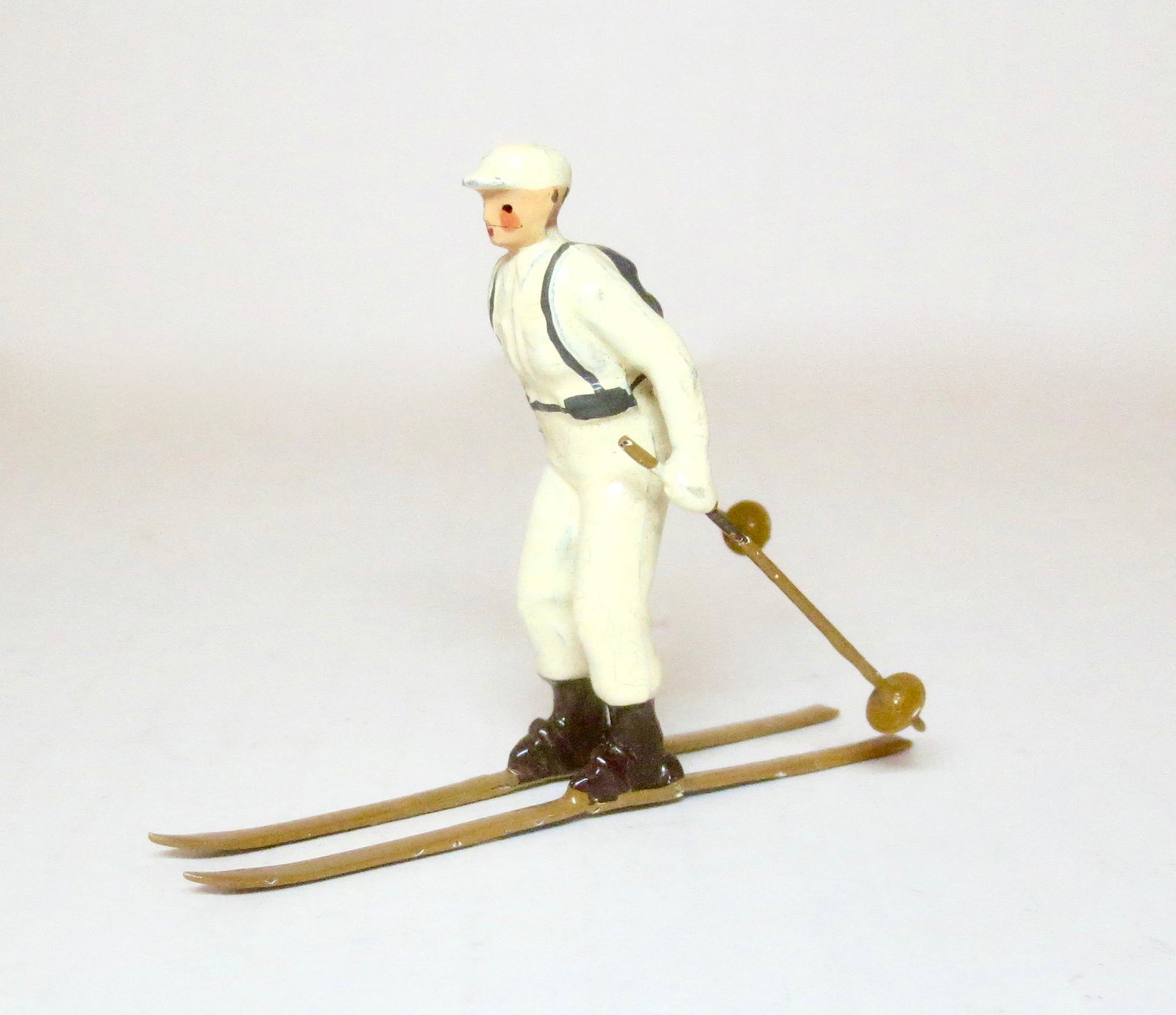Britains #2037 Ski Trooper: Ski Trooper in white snow suit with grey back pack, rifle, brown boots, skis and sticks. Near mint condition. Unboxed.