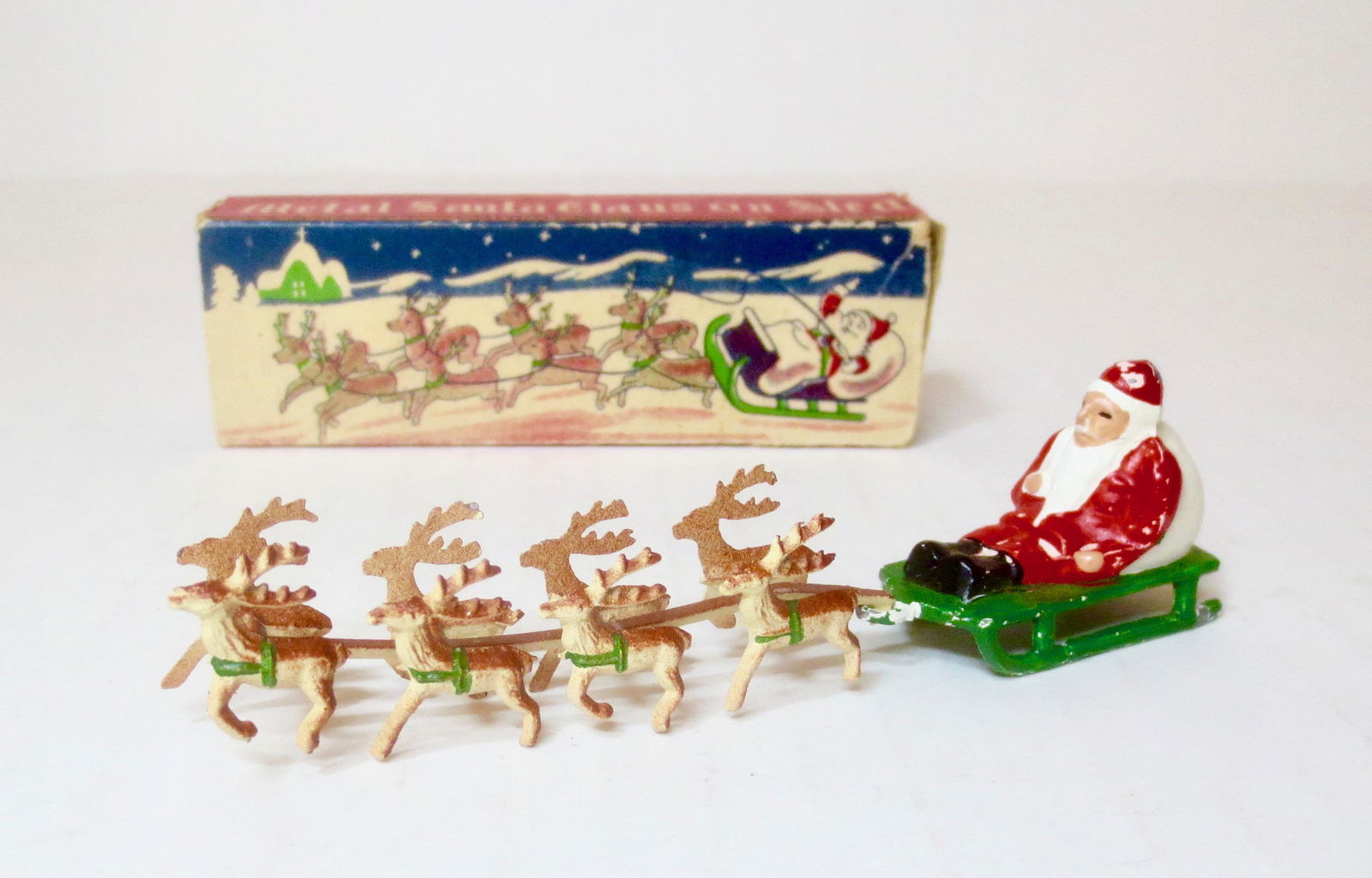 A Perfect Miniature Santa Claus on Sled (1 of 1)