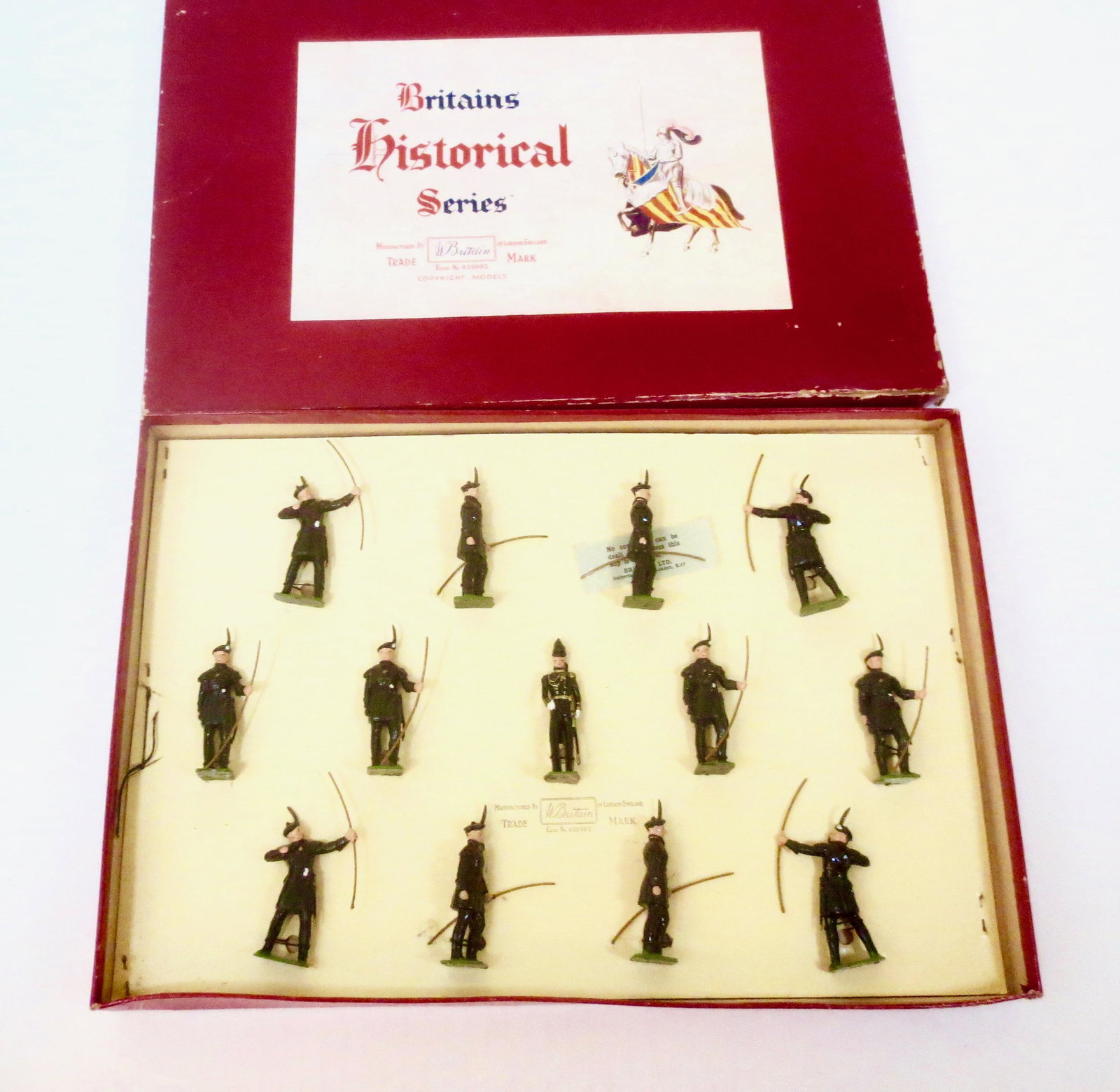 Britains #2079 Royal Company of Archers: The Royal Company of Archers, Queen's Bodyguard for Scotland. Post war, strung in ROAN box. 13 pieces. Excellent condition. Box very good, with some edge wear and a dent to bottom.