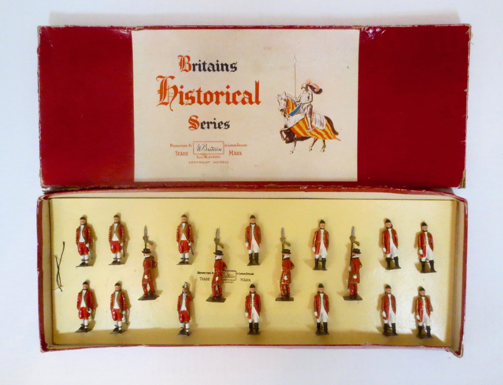 Britains #1475 Royal Household Display Set: Beefeaters, Outriders and Footmen of the Royal Household. Post war, tied in Historical Series box. 18 pieces. Excellent condition (one broken sword). Box fair, with top surface wear, splits and a torn