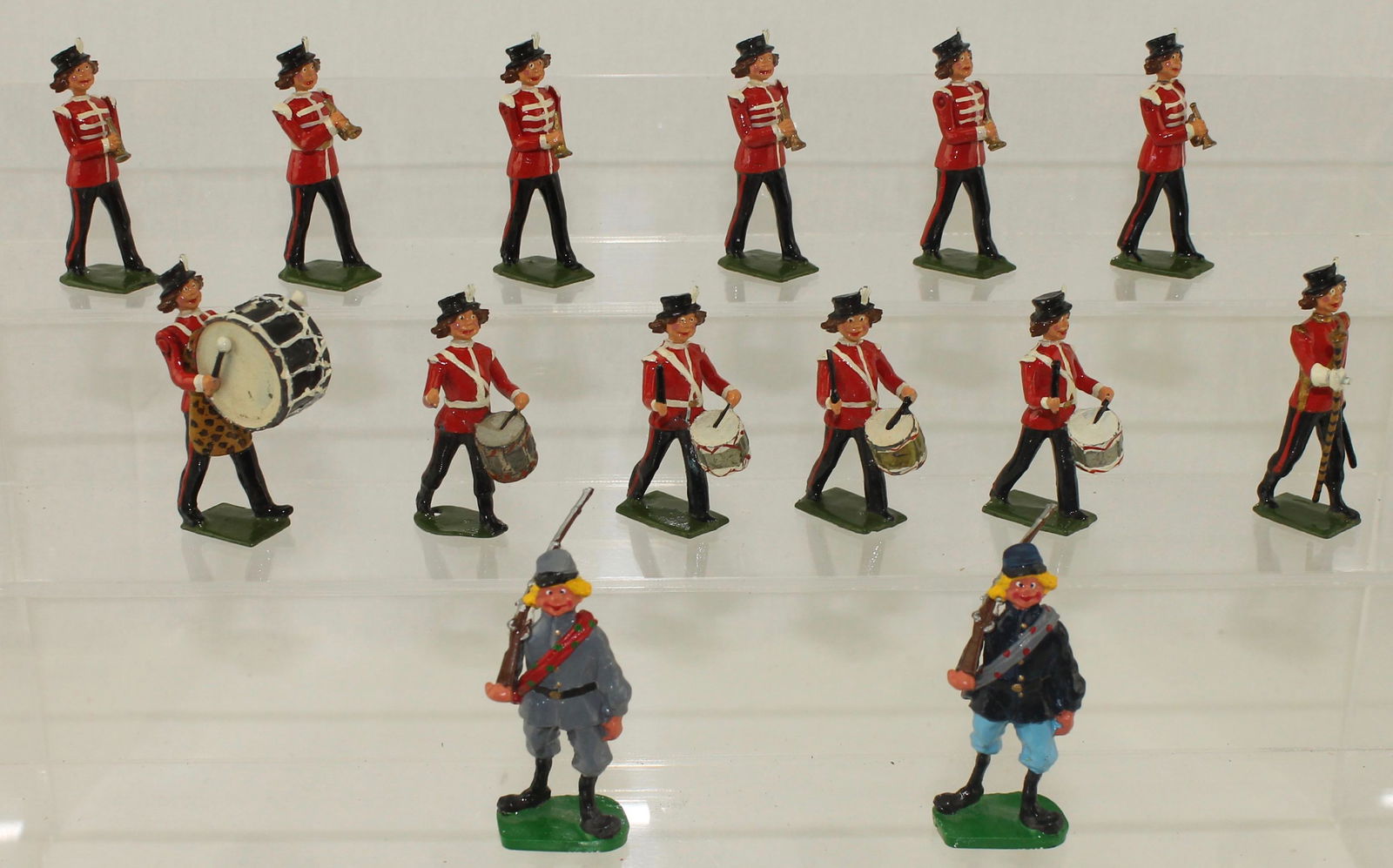 Village Idiot Band by Bill Brunton: Village Idiot Band by the Late Bill Brunton. Lot includes a 12 Piece Band created by Bill using Britains castings from Band of the Line Bodies with Village Idiot Heads. A whimsical take on the Popular