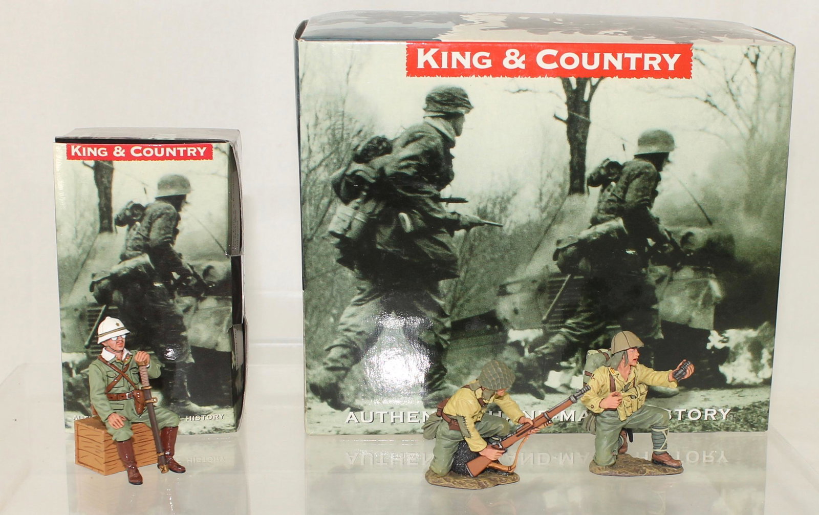 King and Country Lot Japanese General and Troops: Iwo Jima Series. Japanese General and Troops. Lot includes Set #IWJ025 General Kuribayashi and Set #IWJ026 Rifle Propelled Grenade Team. 2 Pieces. Condition Excellent. Boxes Excellent.