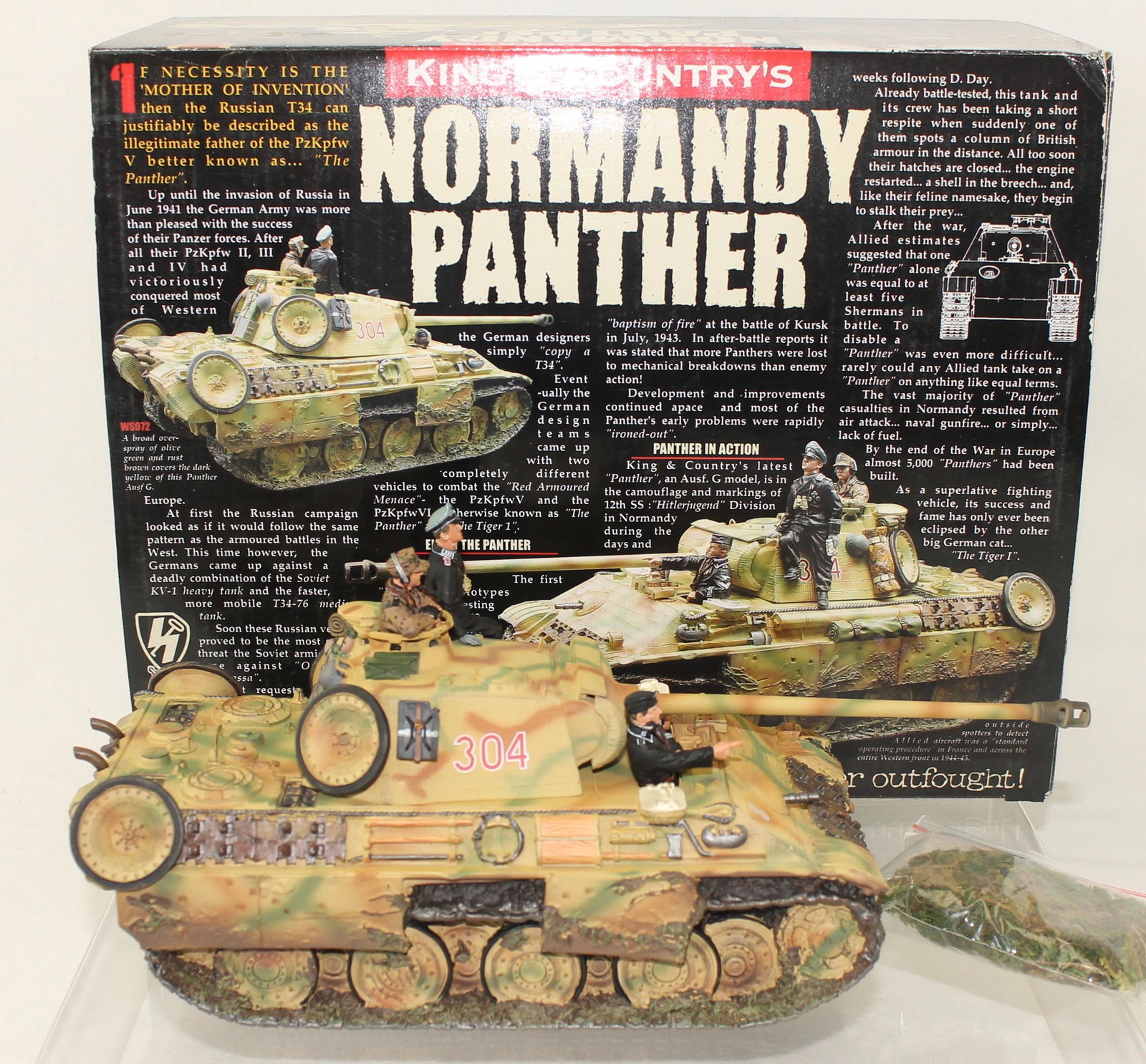King and Country Normandy Panther Tank with Crew: Waffen SS Series. Normandy Panther Tank with Crew. Set #WS072. Summer Version. Includes Crew and Bag of Camouflage Material. 6 Pieces. Condition Excellent. Box Very Good to Excellent.