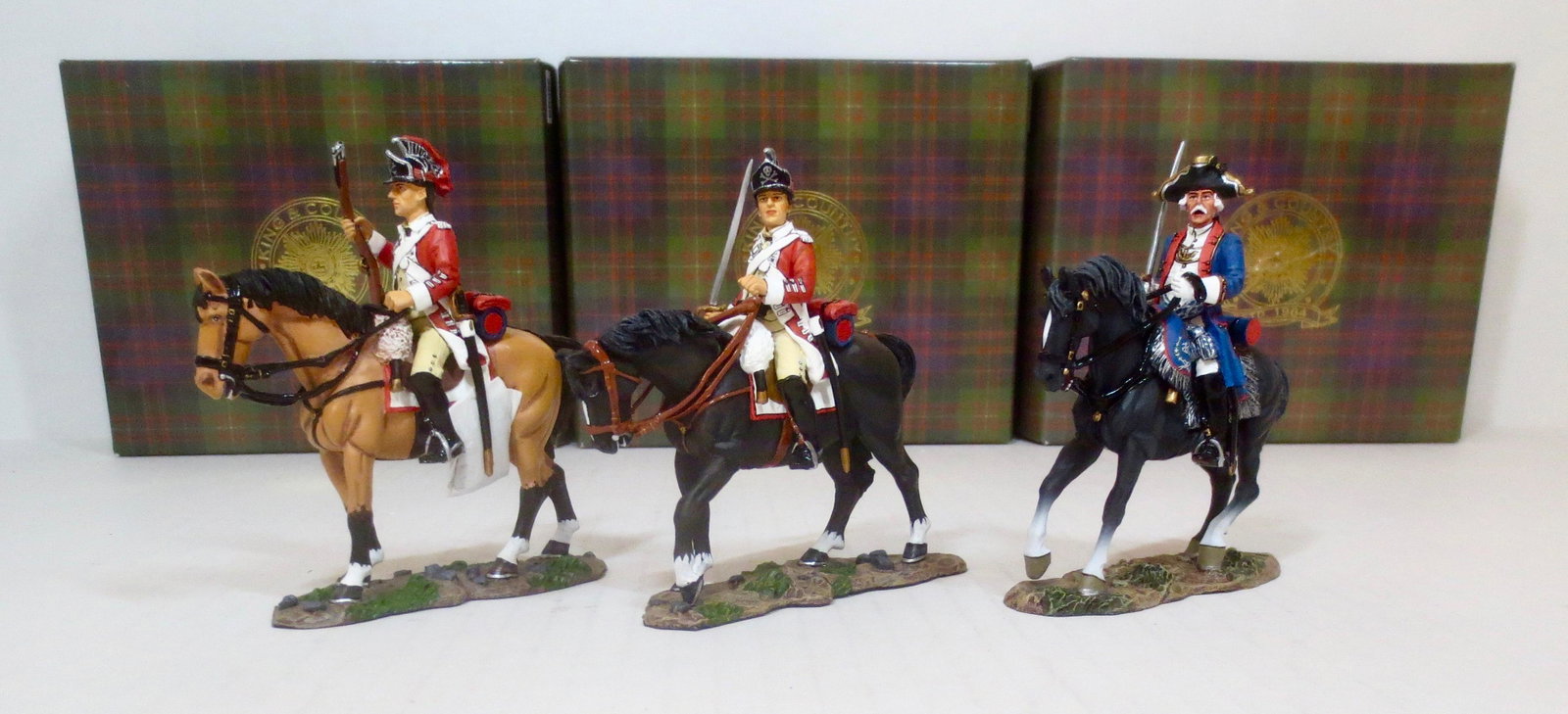King & Country #BR056, 057 and #BR073: From the American Revolution series. British Cavalry with Rifle, Cavalry with Sword, and Mounted Officer. 3 pieces. Retired Figures. Near mint condition. Boxes excellent.