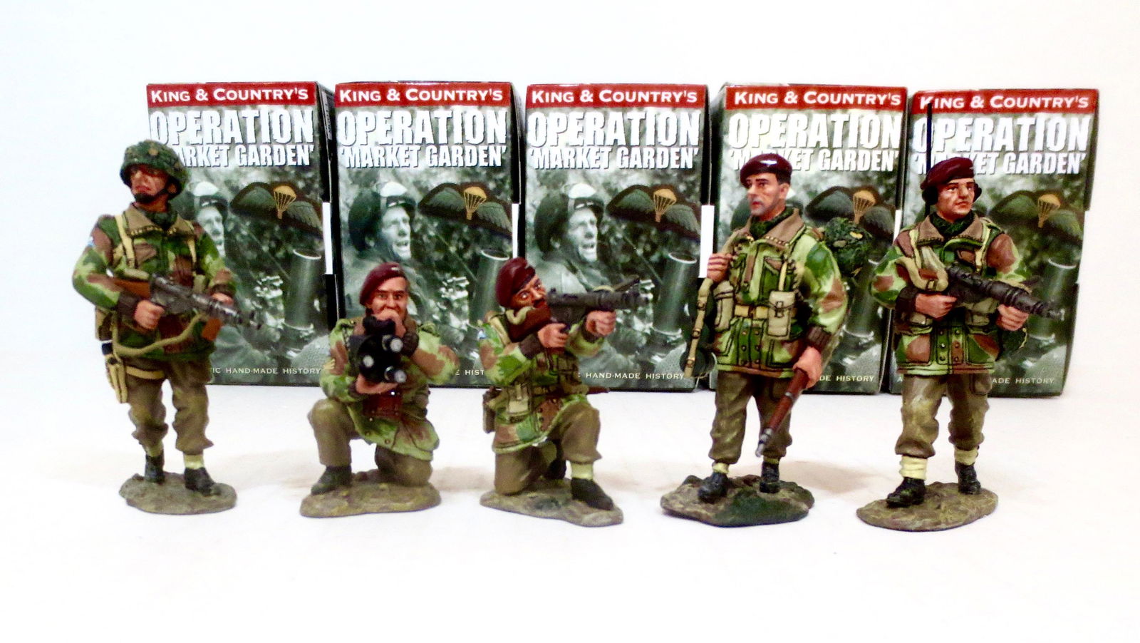 King & Country Operation Market Garden Asst.: Lieutenant Jack Bromley a para platoon leader moving forward with Sten Gun (#MG011), Lance Corporal Robert Thompson with Radio advancing to the front (#MG010), Para walking with rifle (#MG017), kneeli