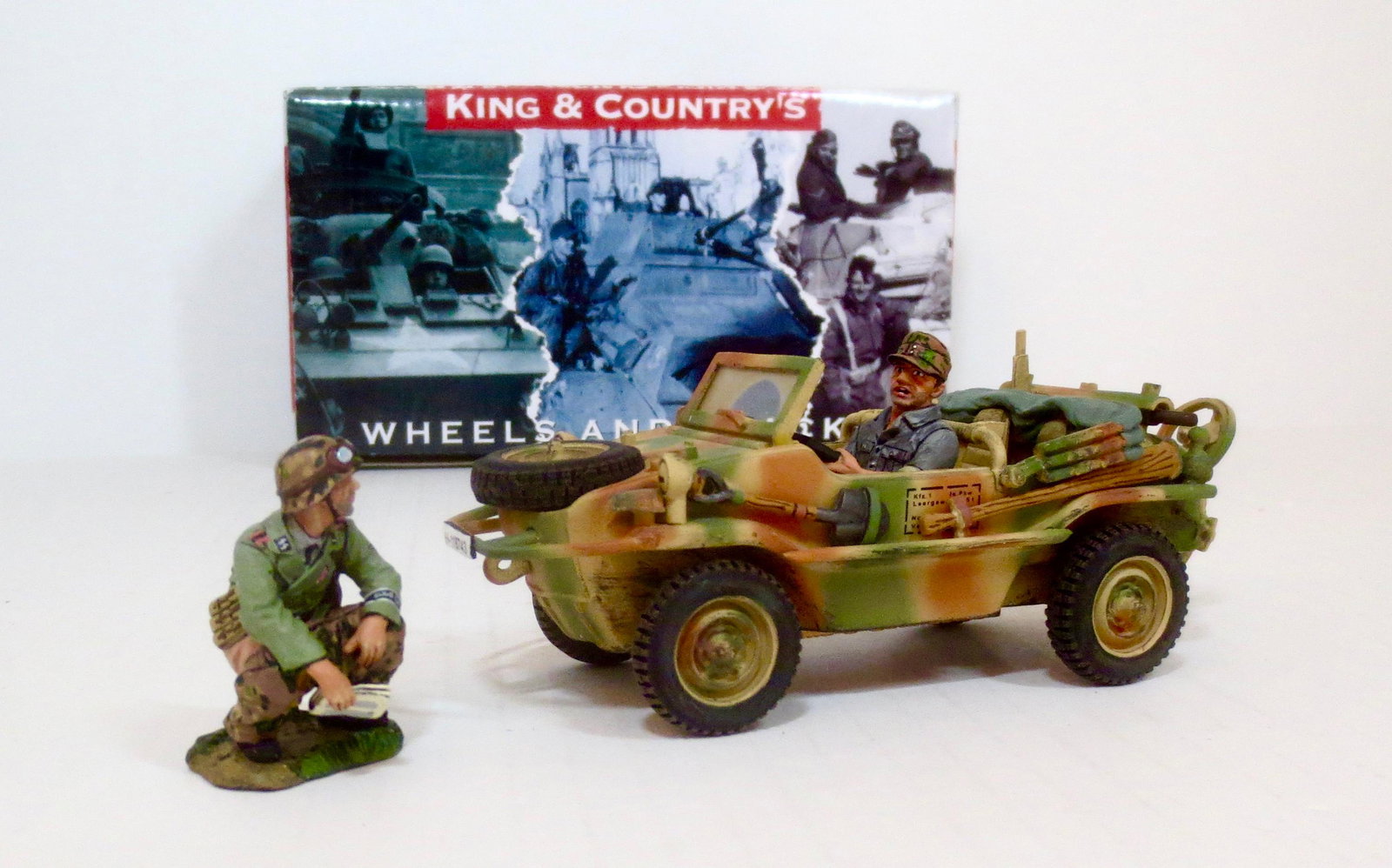 King & Country #WS109 Summer Schwimmwagen: A pair of Waffen SS Panzer Grenadiers on a reconnaissance mission are side tracked when one of them gets an urgent call-of-nature. 2 pieces. Retired set. Near mint in box. Box excellent.