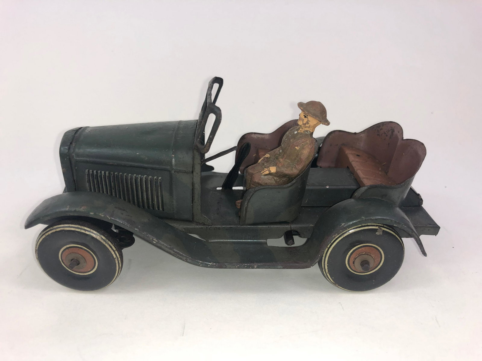 Tinplate Staff Car with Driver: Good condition overall. Composition drive mismatched. It is 6-1/2 inches long.
