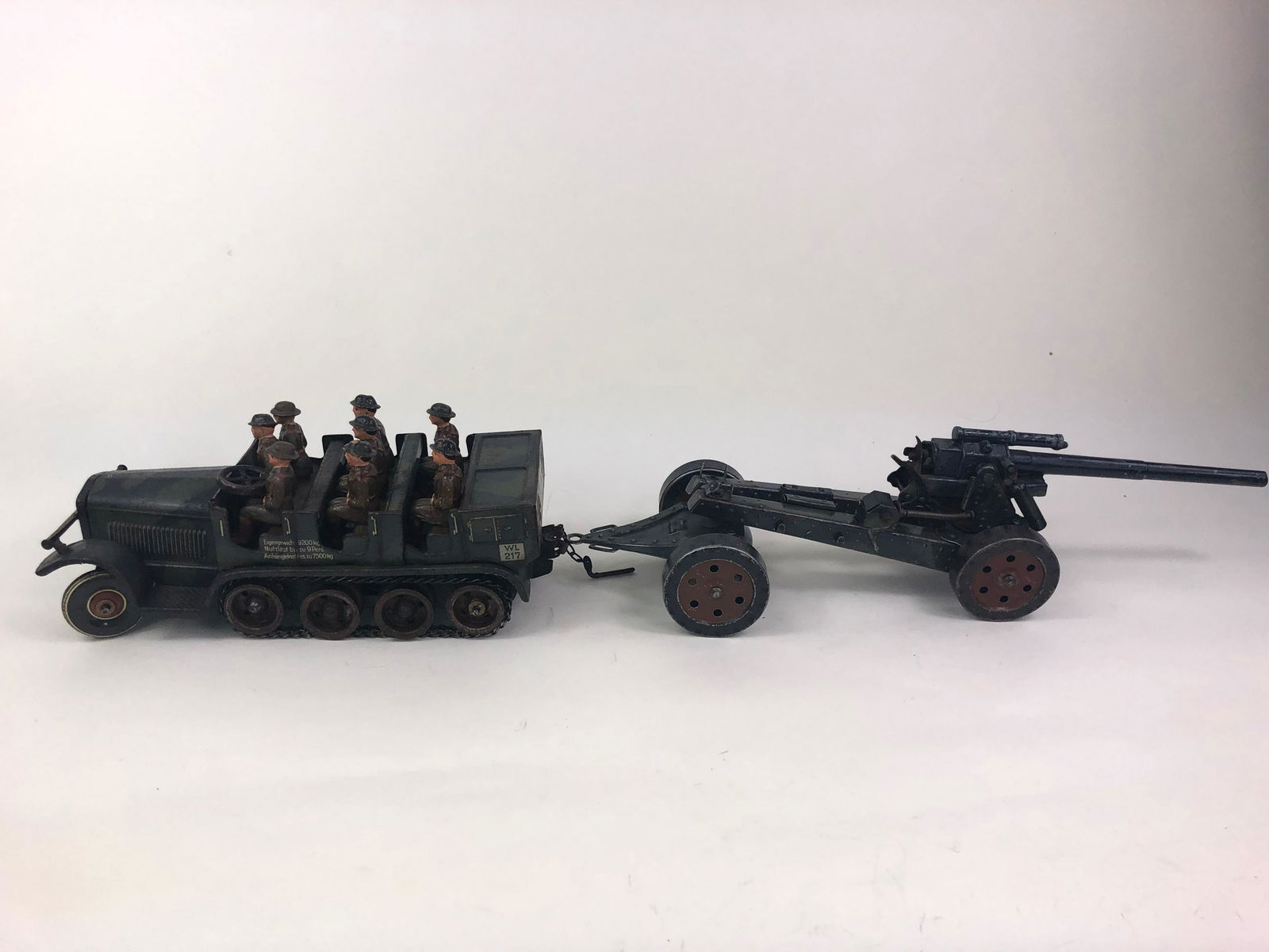 Tippco Troop Carrier and Towed Artillery Piece: Impressive set with 150cm gun. Nine crew in good condition. It is 8-1/2 inches long.