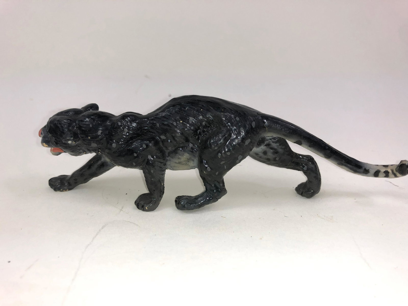 Lineol Composition Clouded Leopard: One piece composition in superb condition. In the mold he is stamped "Germany." He is about 5 inches long.