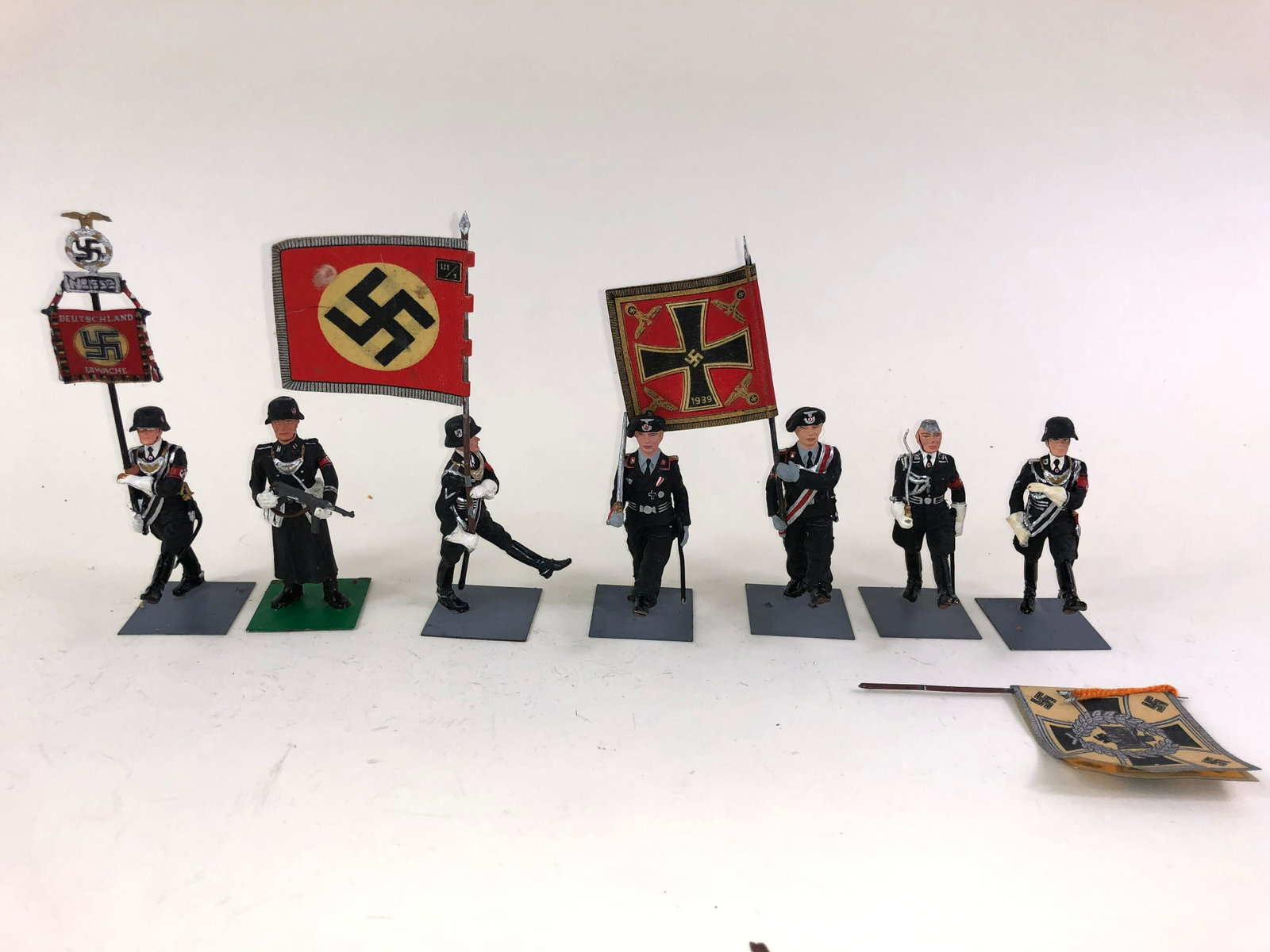 J. Almirall German World War II Nazi Parade: 8 pieces in good to very good condition. One detached flag . They are 54mm.