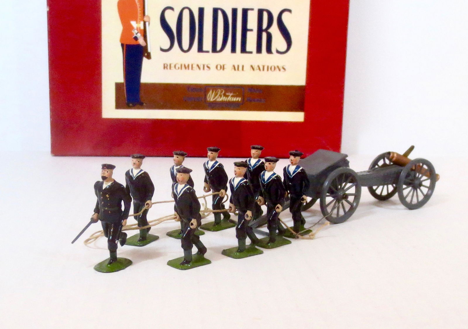 Britains #79 Royal Navy Landing Party with Gun: Royal Navy Landing Party with Running Petty Officer and Sailors pulling Limber & Gun. Post war issue. 11 pieces. Excellent condition. Box very good.