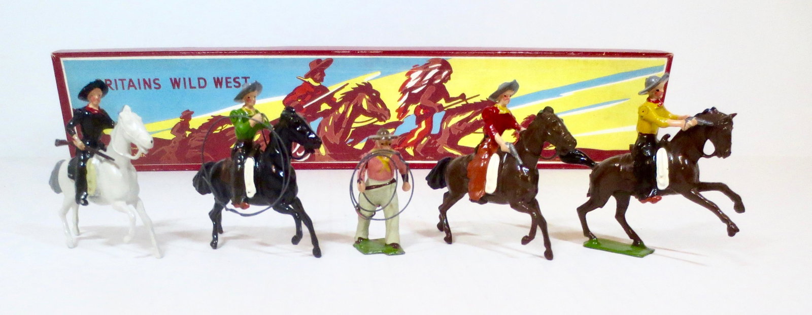 Britains #179 Wild West Cowboys: American Cowboys Mounted and on Foot. Post war with Illustrated box. 5 pieces. Excellent condition. Box excellent.