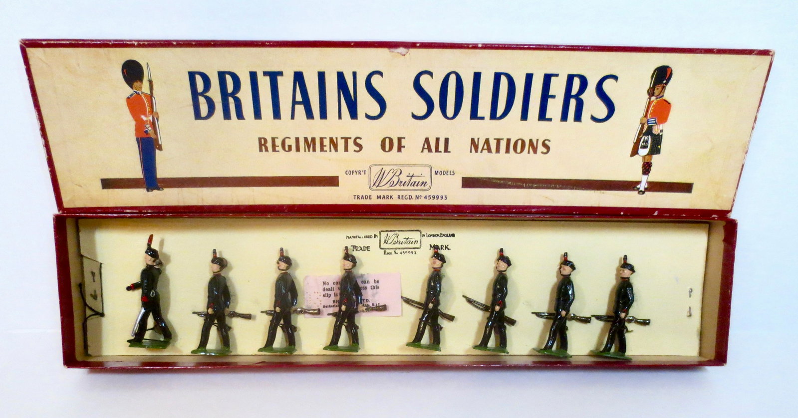 Britains #2072 King's Royal Rifle Corps: Marching at the Trail. Post war issue. 8 pieces. Mint condition, tied to card in ROAN box. Box very good (paper beginning to bubble on top side).
