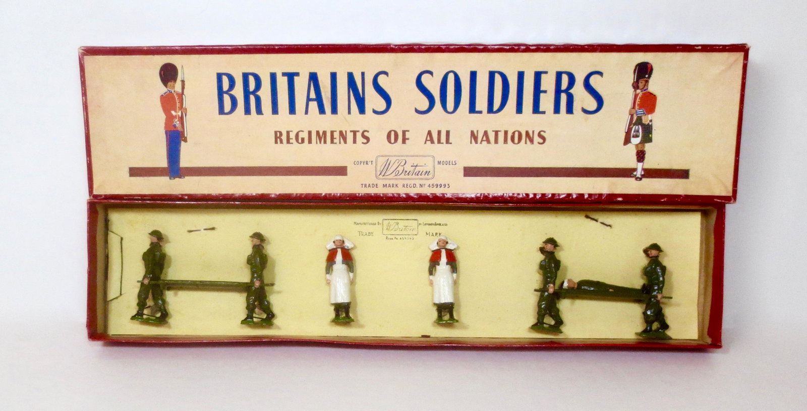 Britains #1723 Royal Army Medical Corps: Stretcher-Bearer Unit. Post War issue, 1946-59. 8 pieces. Mint to near mint condition, tied to card in ROAN box (patient is loose). Box fair, with top paper peeling.