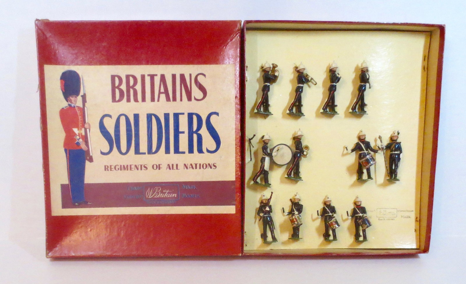 Britains #2153 Band of the Royal Marines: Royal Marines Band. Post War, circa 1957-60. 12 pieces. Mint condition, tied to card in ROAN box. Box very good, slightly crushed top.