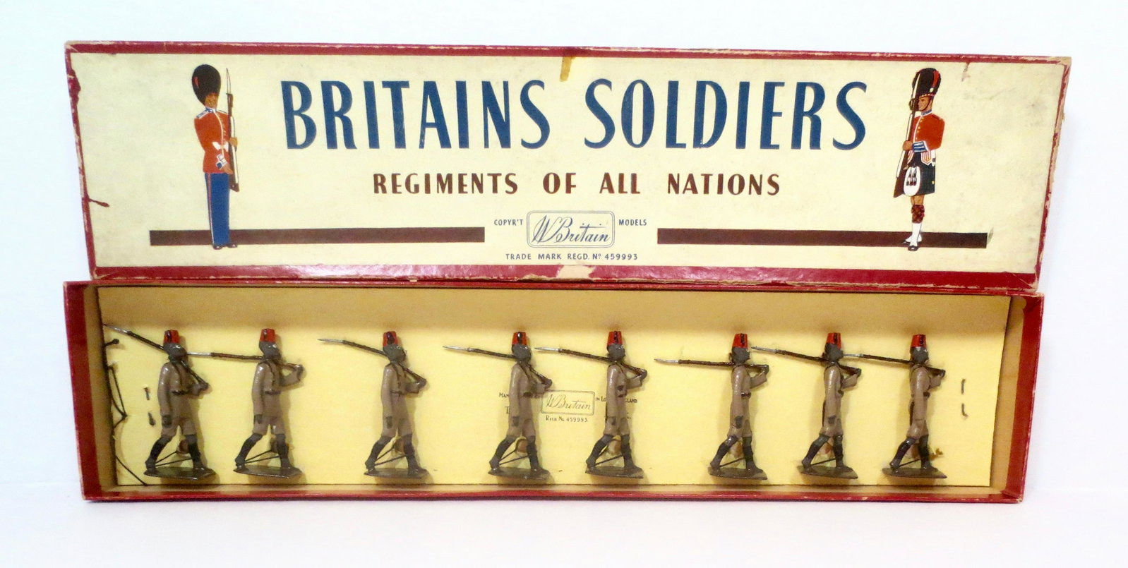 Britains #225 The King's African Rifles: Marching at the slope. 8 pieces. Post war. Mint condition, tied to card in ROAN box. Box good, with some surface wear.